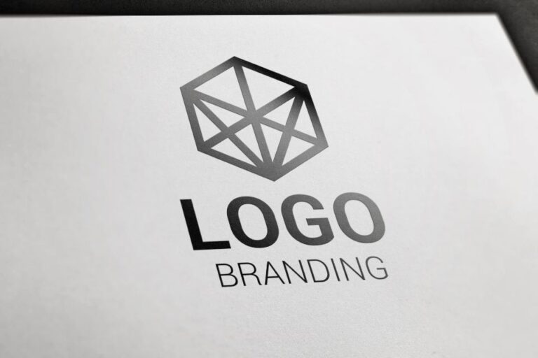 A sample logo design featuring a geometric polygonal shape above the words 'LOGO' and 'BRANDING' on a white background