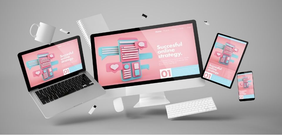Digital devices (laptop, desktop, tablet, and smartphone) displaying modern UI/UX designs
