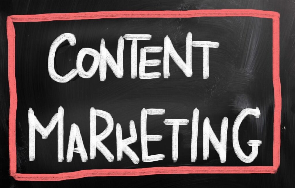 Content Marketing written in bold chalk letters on a blackboard, framed with a red border to emphasize strategic messaging