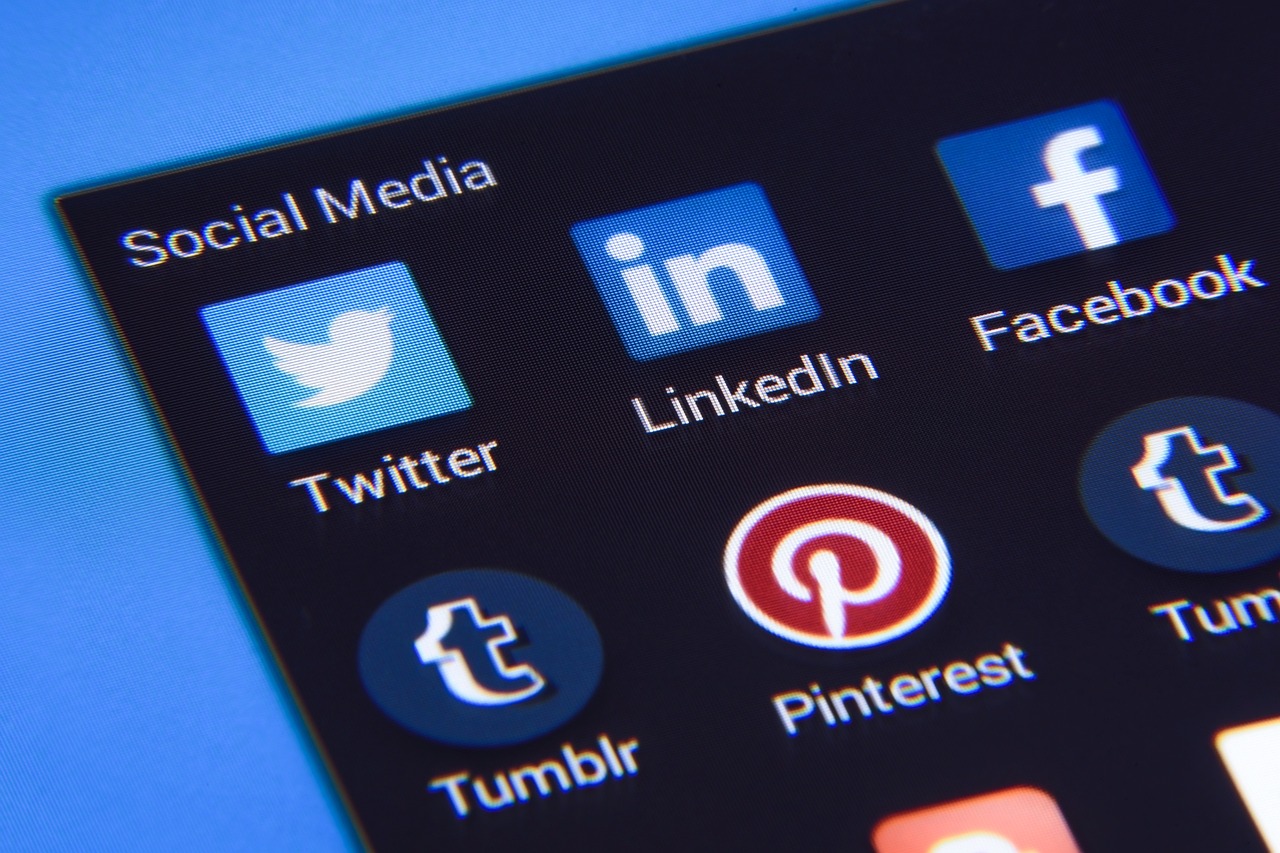 Smartphone screen showing LinkedIn and other social media app icons, representing LinkedIn marketing and digital networking platforms