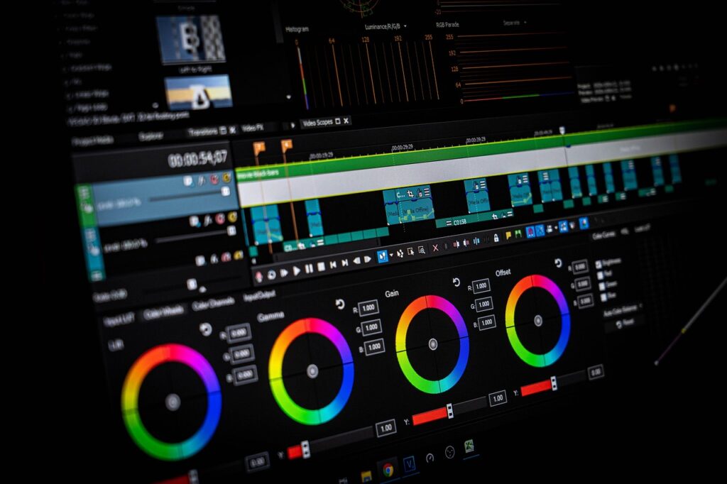 A close-up of professional video editing software focused on the color grading tools, with vibrant color wheels for precision adjustments below the video timeline.