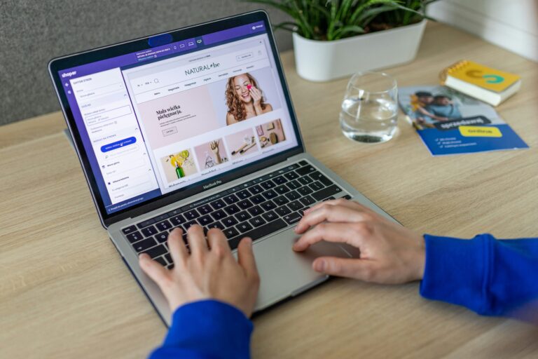A person building an ecommerce website on a laptop
