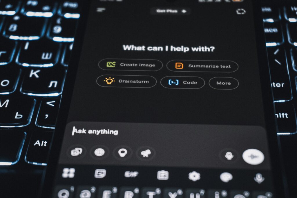 Smartphone screen displaying AI assistant options like create image, summarize text, brainstorm, and code, symbolizing the use of artificial intelligence in digital productivity
